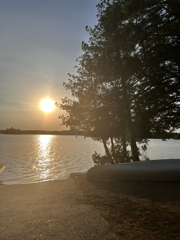 Canoe at the shore at sunset