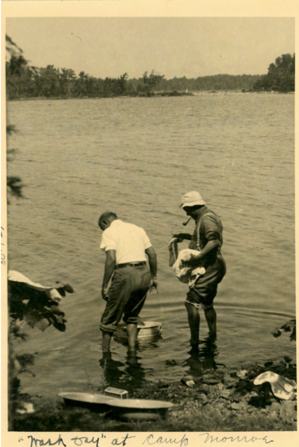 W.E.B. Du Bois and another member at the lake's edge with washing buckets